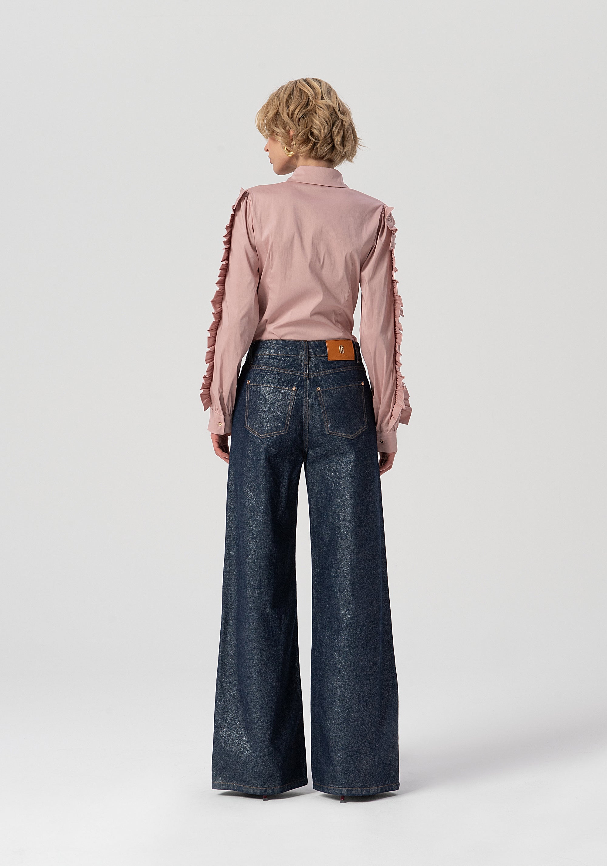 Jeans flare a palazzo in denim con spalmatura