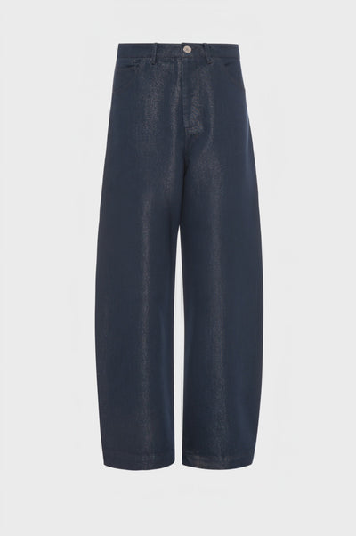Jeans carrot balloon fit in denim con spalmatura